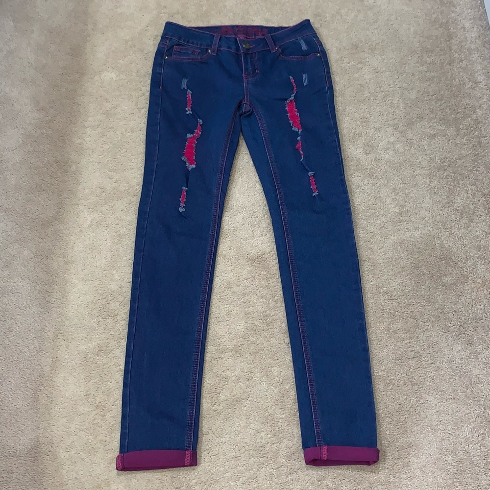 Pink distressed jeans